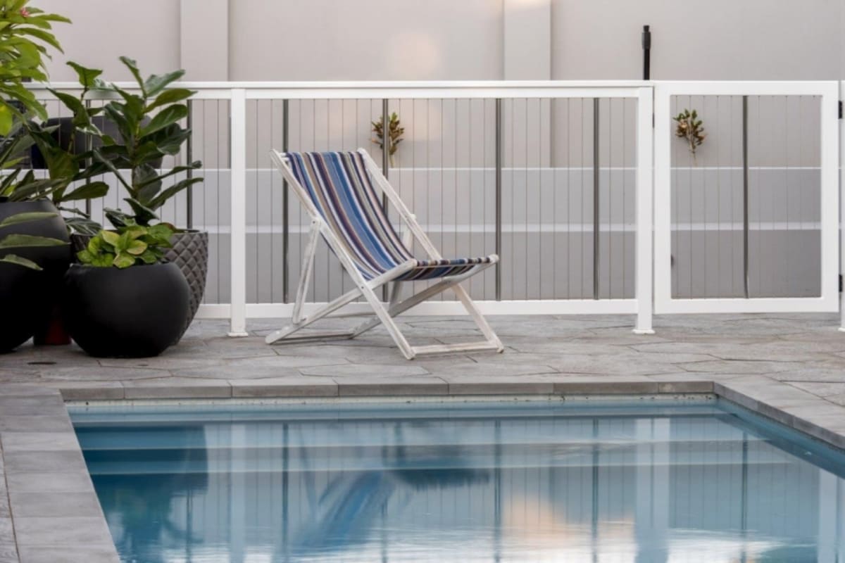 sentrel aluminium vertical cable pool fence around a residential pool